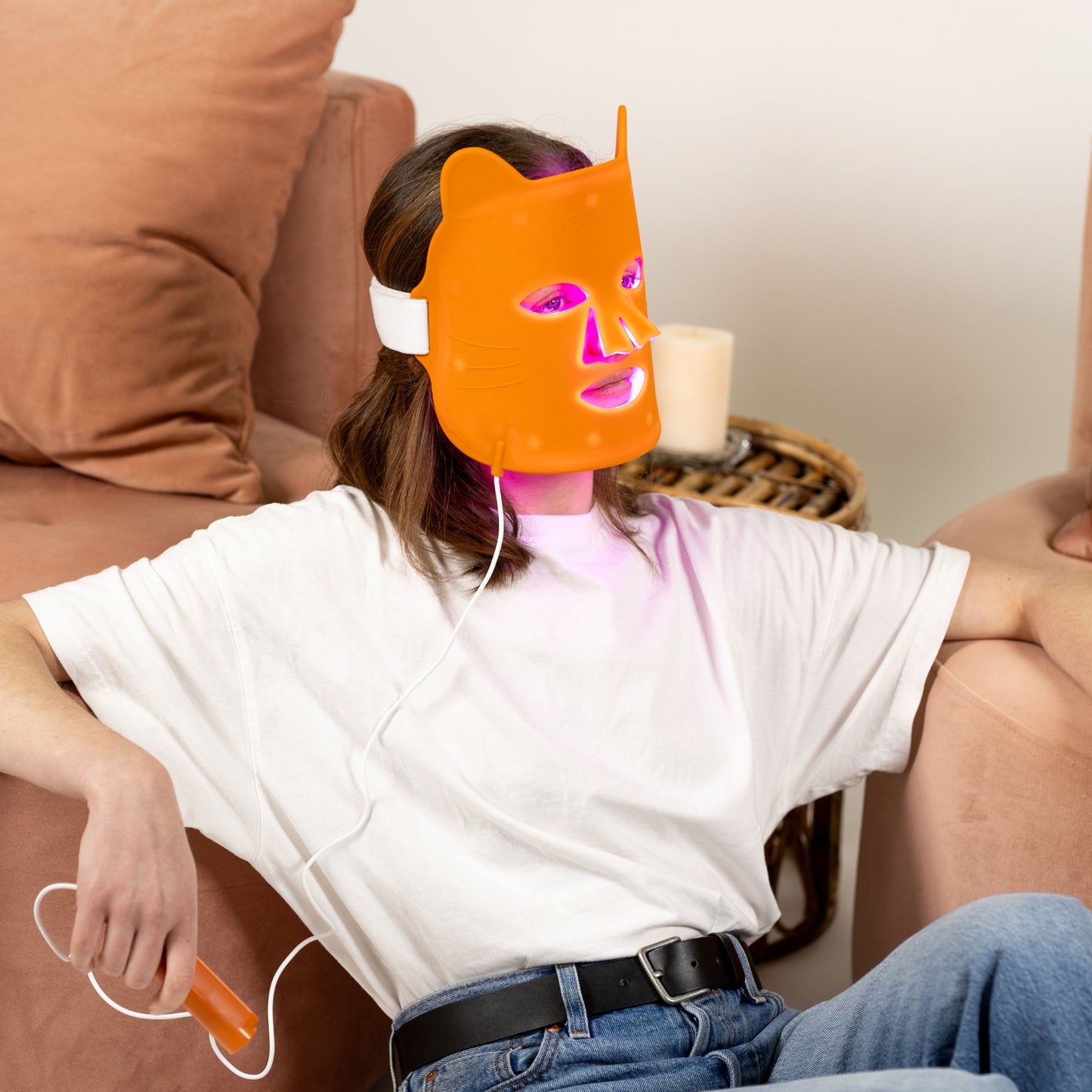 How-to guide image showing a woman relaxing while using the Faeves Clarifying LED Mask, demonstrating the comfortable and effective application of the product.